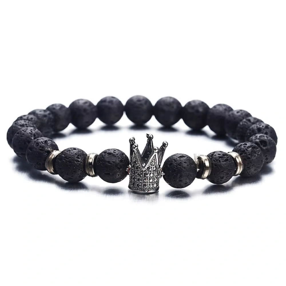 Black beaded bracelet with a silver crown charm on a white background