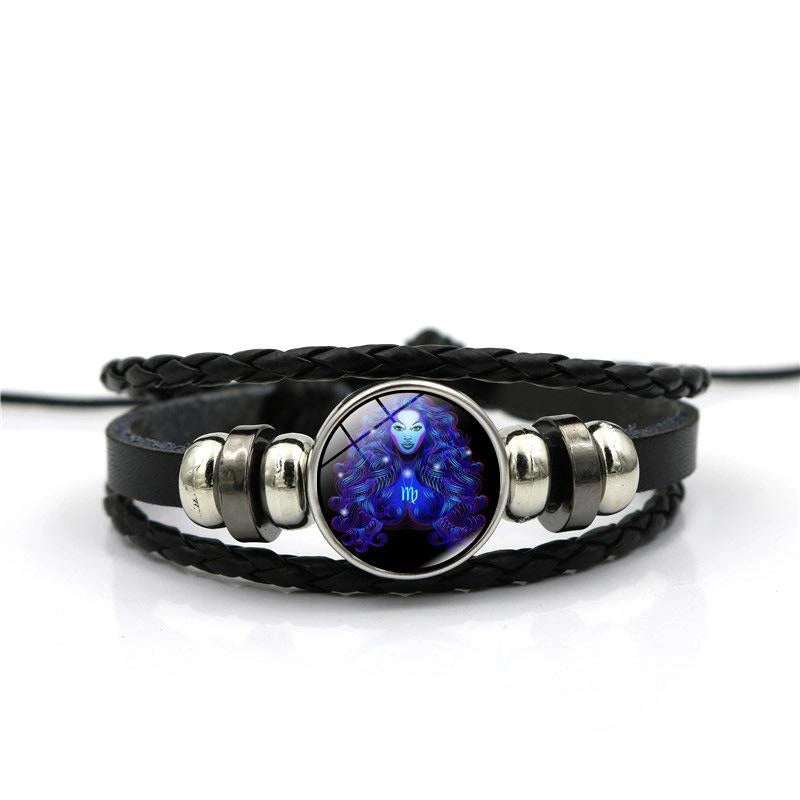 Black braided leather bracelet with a blue and silver pendant on a white background