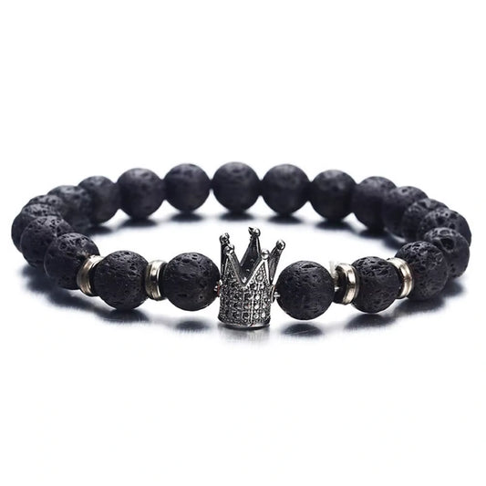 Black beaded bracelet with a silver crown charm on a white background
