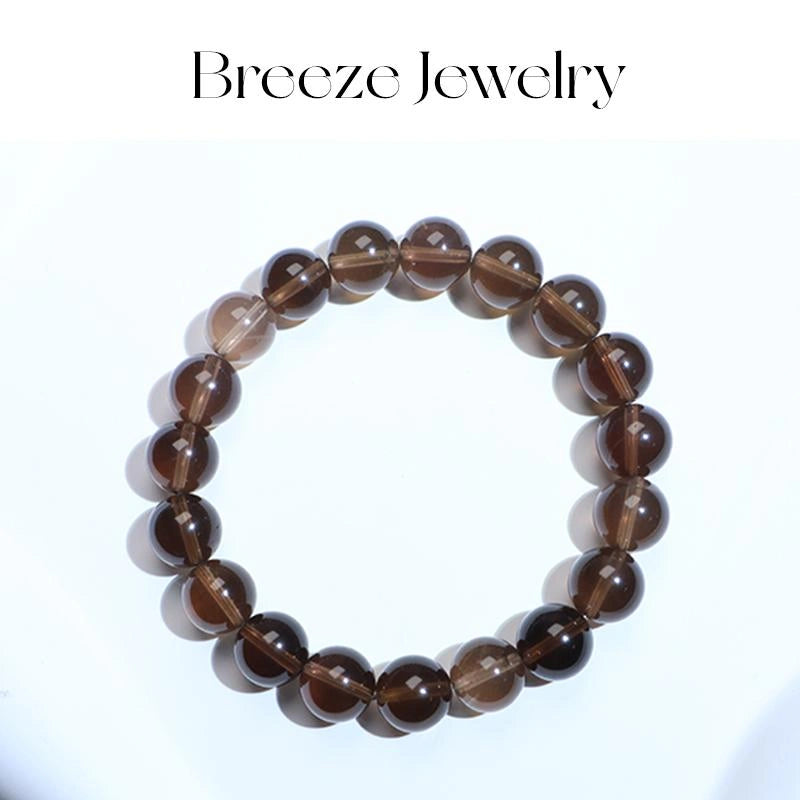 Brown beaded bracelet on a white background with 'Breeze Jewelry' branding.