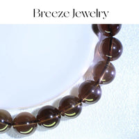 Brown beaded necklace on a light gray background with 'Breeze Jewelry' branding.