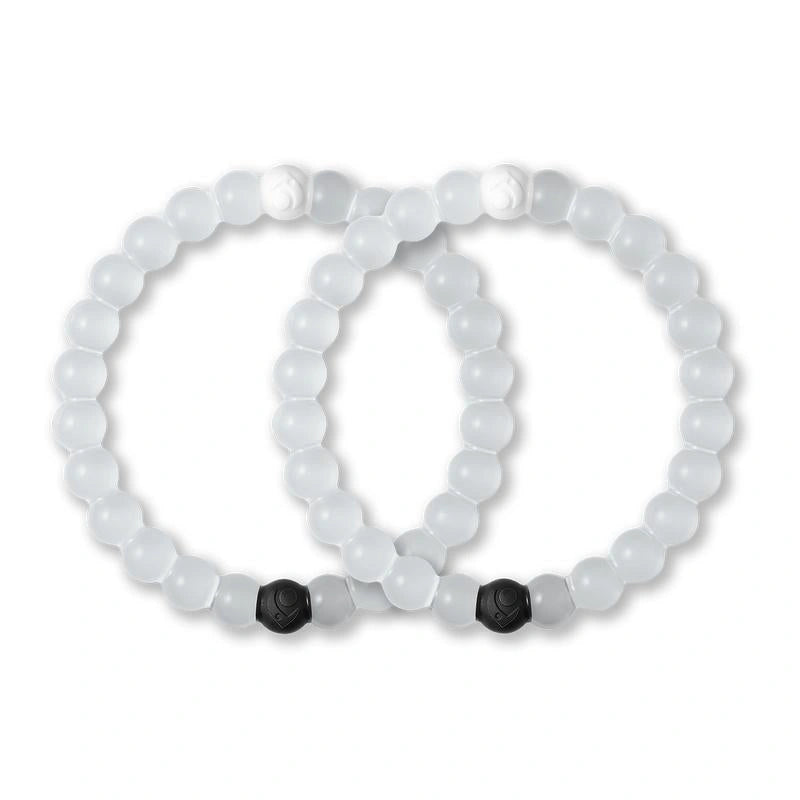 Two white beaded bracelets with black beads on a white background