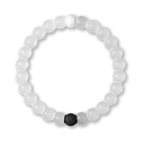 White beaded bracelet with a black hexagonal charm on a white background