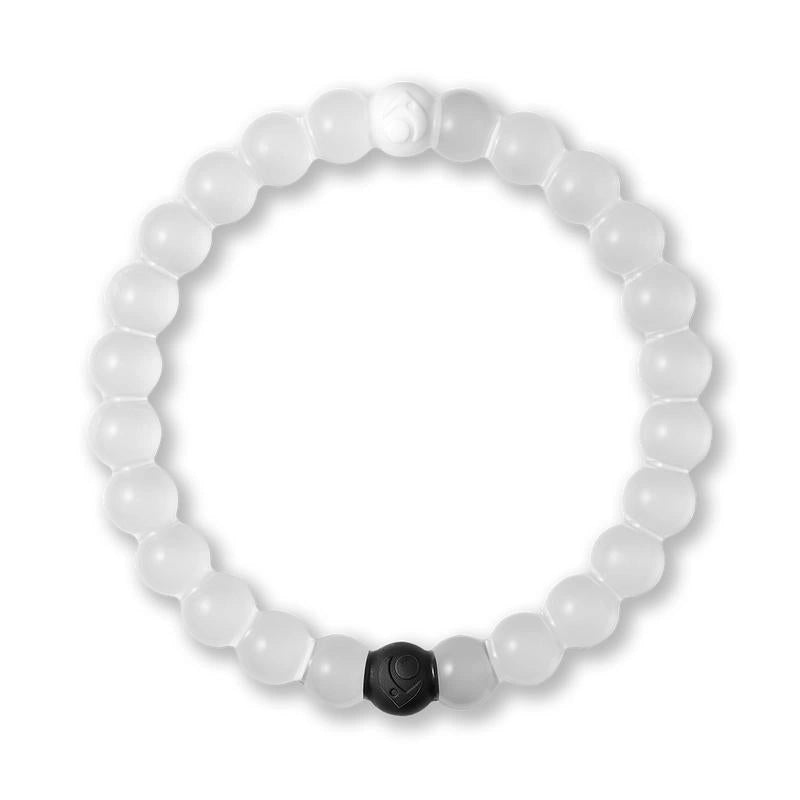White beaded bracelet with a black hexagonal charm on a white background