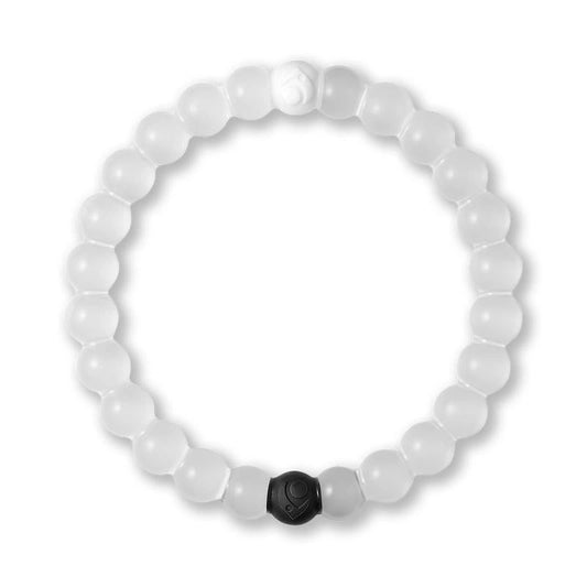 White beaded bracelet with a black hexagonal charm on a white background