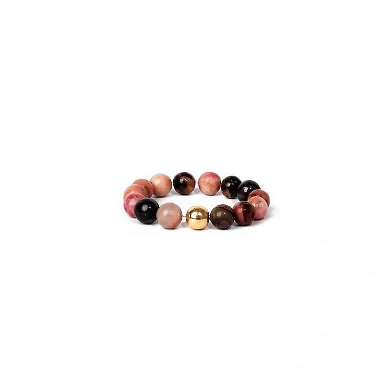 Multicolored beaded ring on a white background