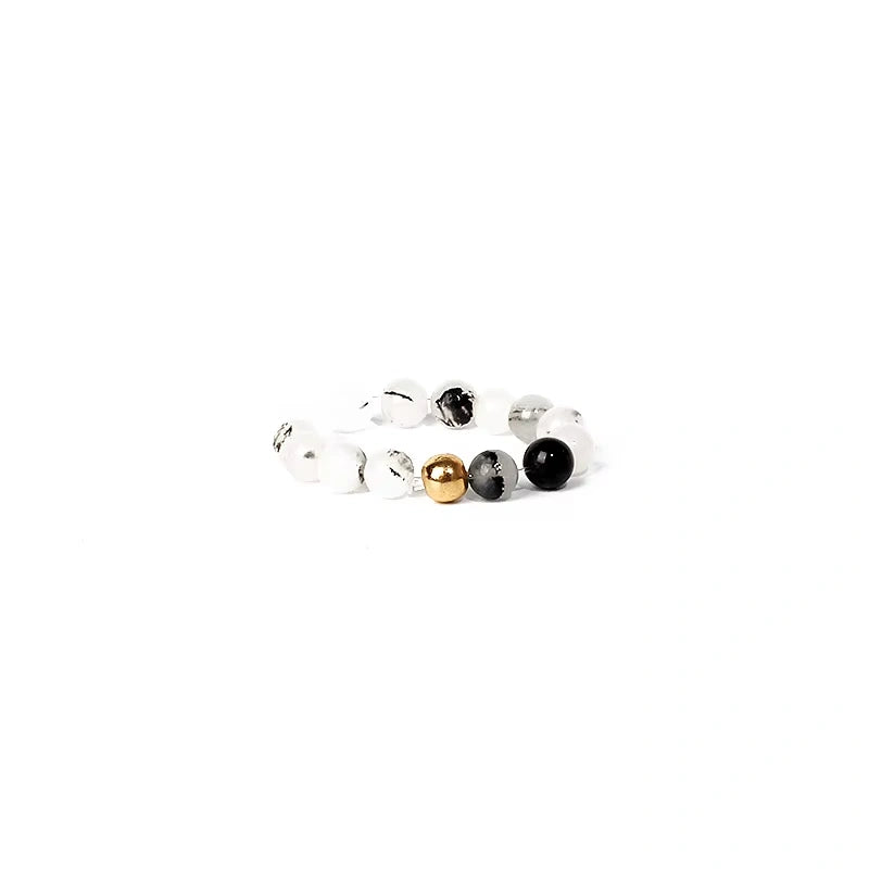 ring with multicolored beads on a white background