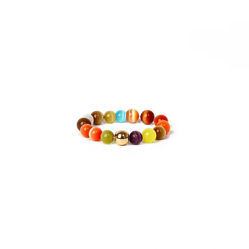 Multicolored beaded ring on a white background